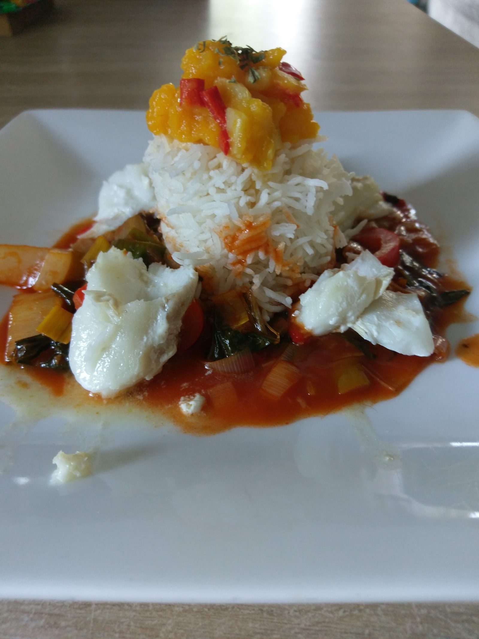 Spicy fish dish with papaya chutney